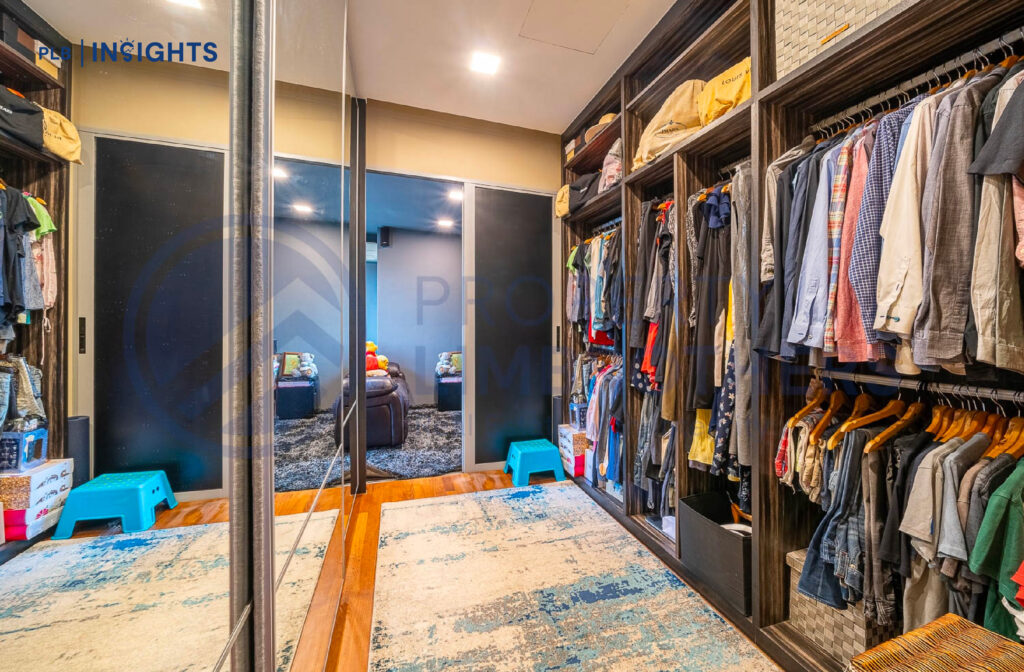 Walk-in wardrobe with full-length sliding mirror doors